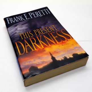 This Present Darkness Paperback by Frank E. Peretti